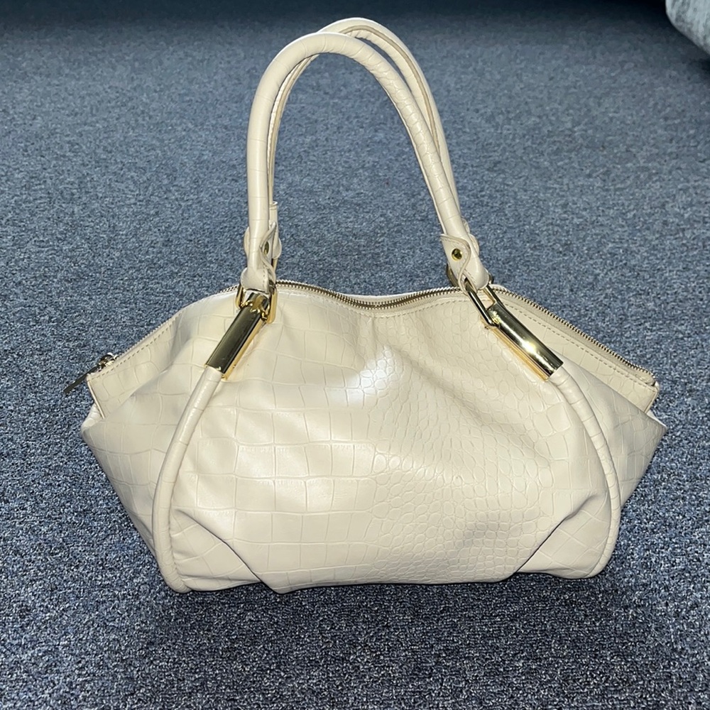 Cream handbag with gold hardware